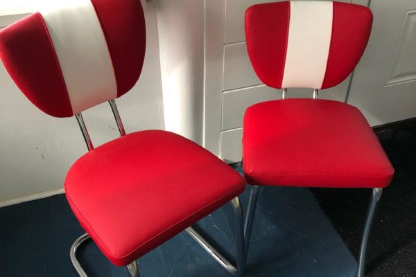 Brightly colored red and white upholstered chairs